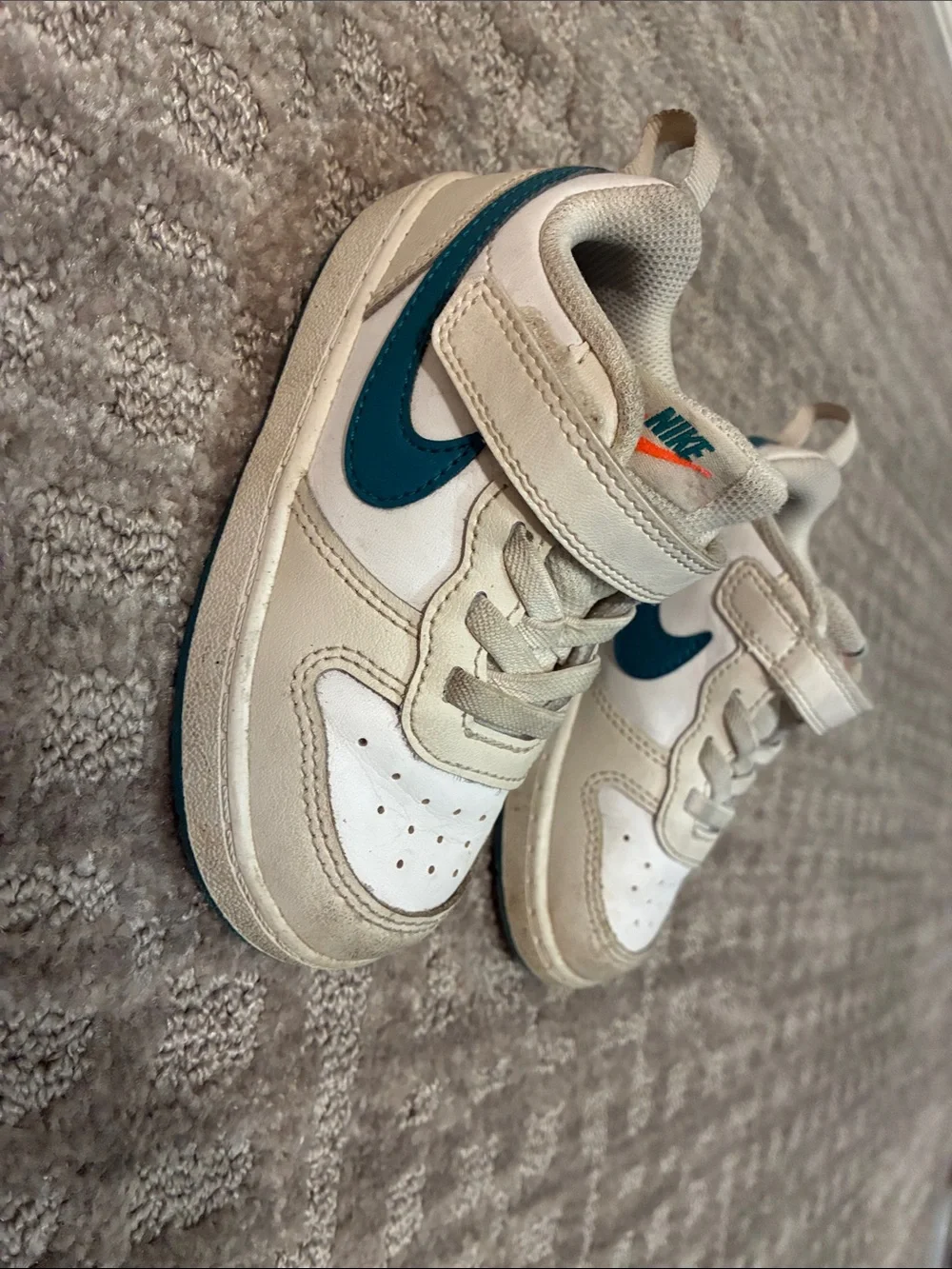 Nike Kids White Sneakers with Teal Swoosh and Orange Logo